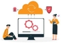 A man and woman sitting in front of a computer with a cloud on it.