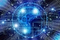 An image of a brain surrounded by electronic circuits.